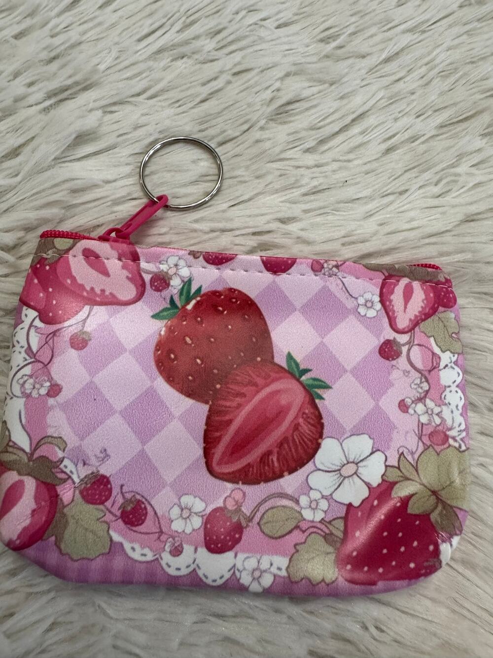 Pink & white strawberry-themed coin pouch keychain pink and white background